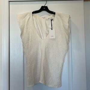 Cream v-neck blouse, with textured detailing
